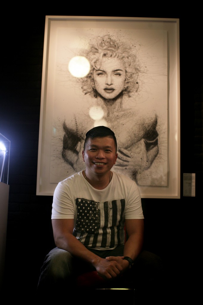 EXUBERANT: Vince Low poses in front of his Madonna piece at The Connoisseur Concerto where his exhibition will be held till June 2.