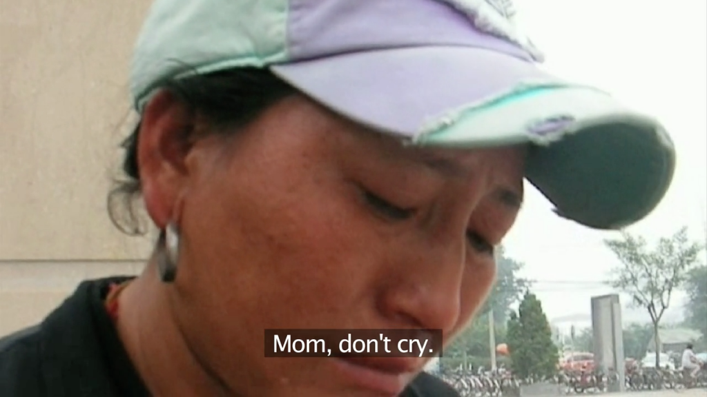 HOPELESSNESS: Zanta is comforted by her son, Yan Qing, as she breaks down during an interview.